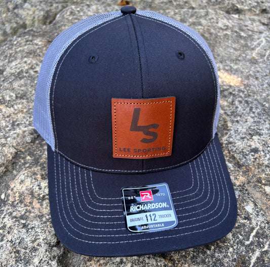 Navy blue Richardson cap with leather patch featuring the Lee Sporting logo